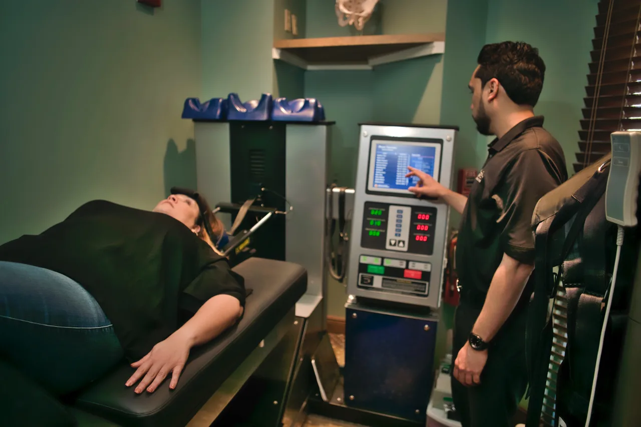Patient using spinal decompression equipment in Orlando