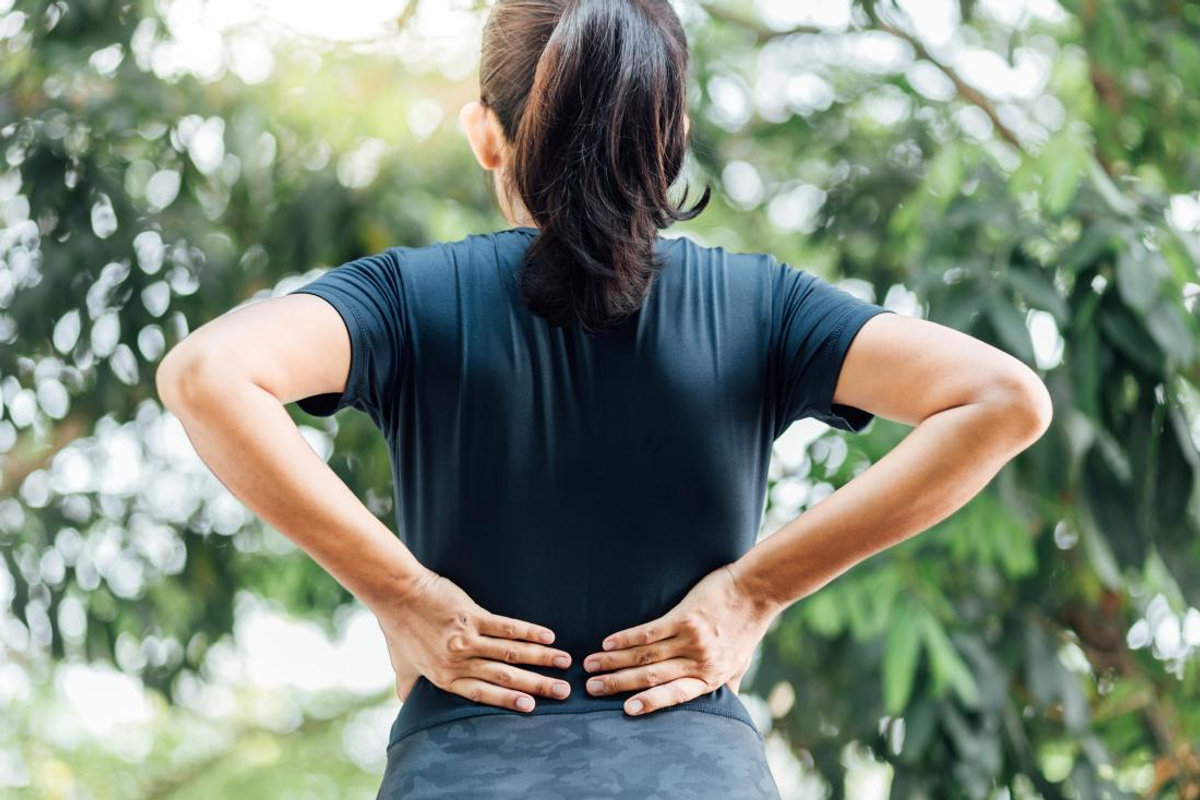 Chiropractor treating a patient's lower back pain in Orlando